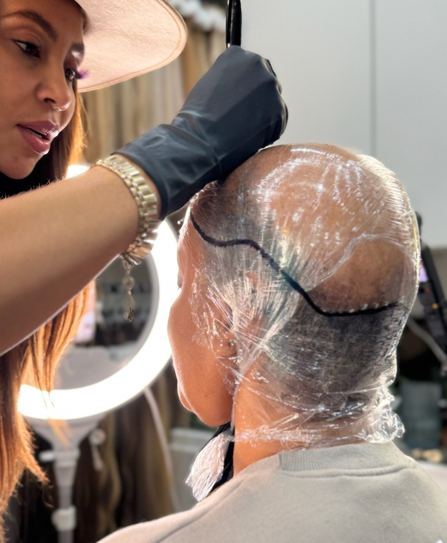 A custom head mold used to shape a hair system to one woman's head